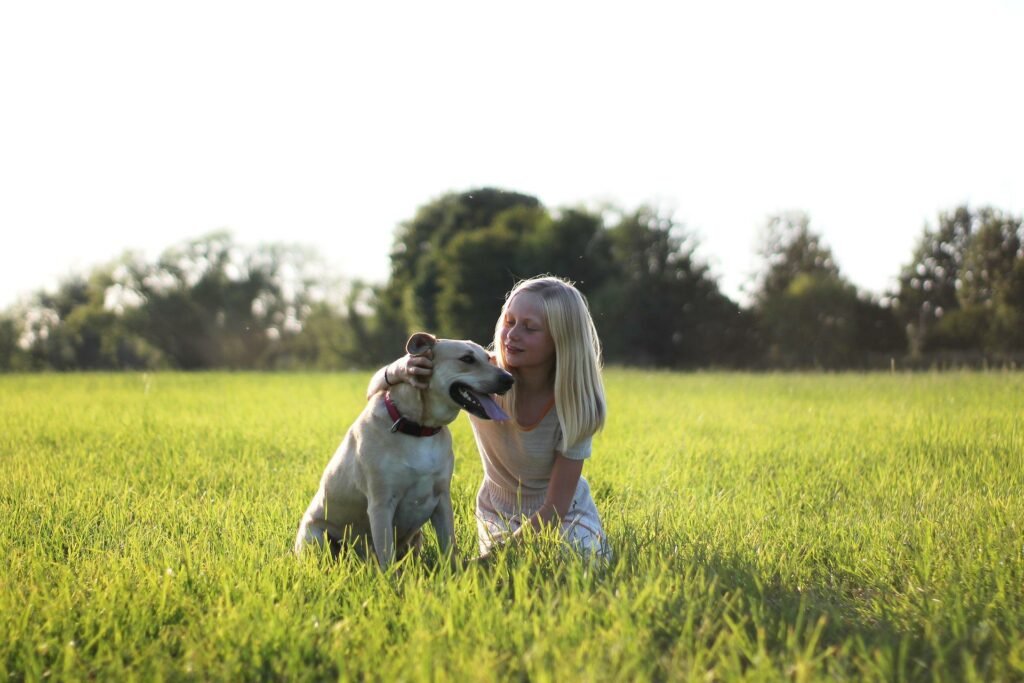 A pet owner with her Labrador
