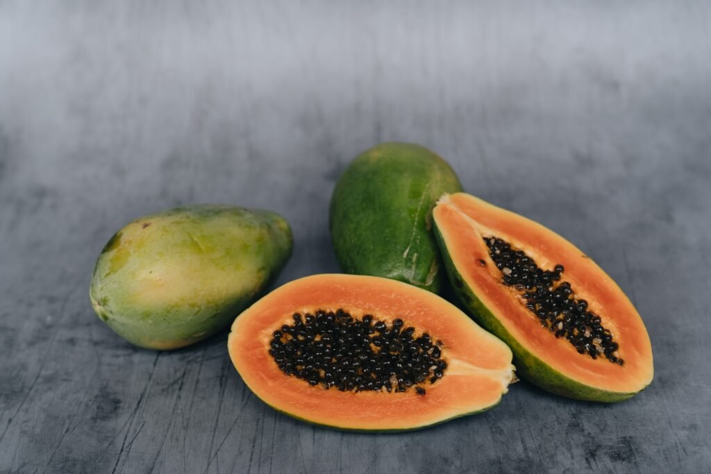 Full and sliced papaya