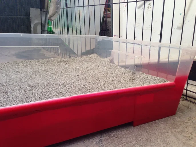 Giant litter box from a large plastic bin