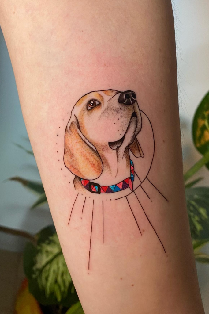Beagle Face tattoo on a person's leg