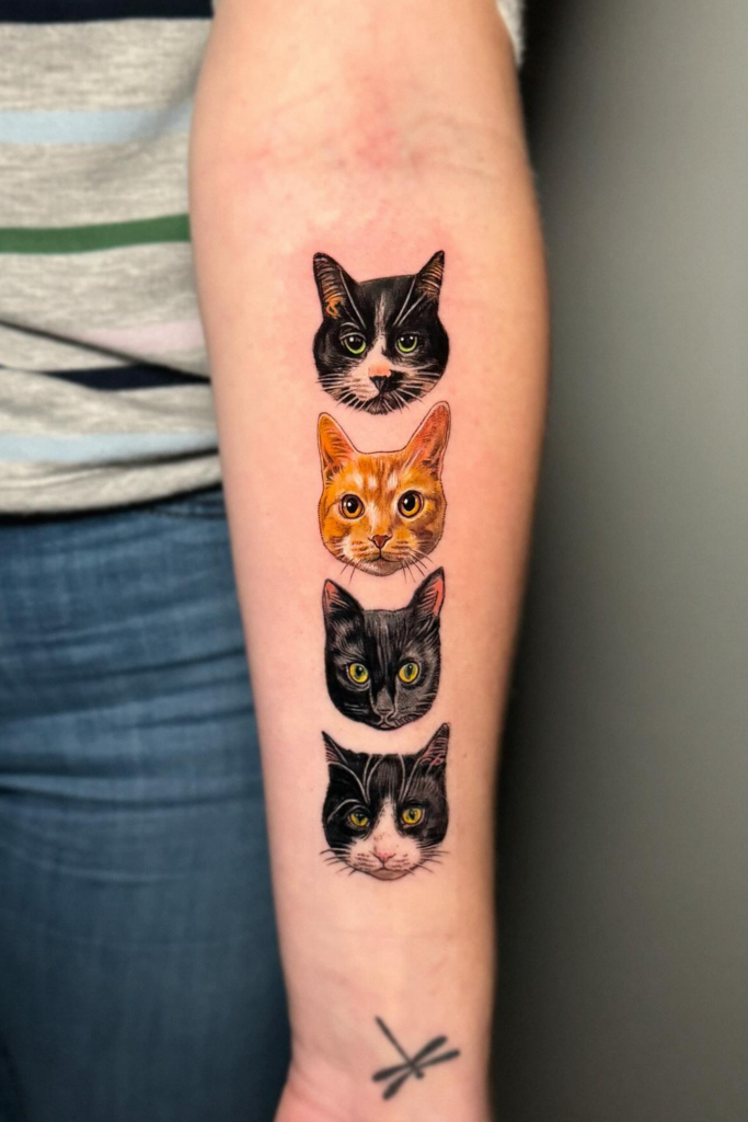 A person showing his arm with four cat face tattoos.