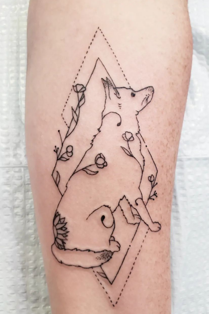 Geometric tattoo on an arm, depicting a dog's full body in tribute.