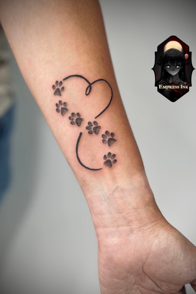 Tattoo of a heart shape formed from individual paw prints.