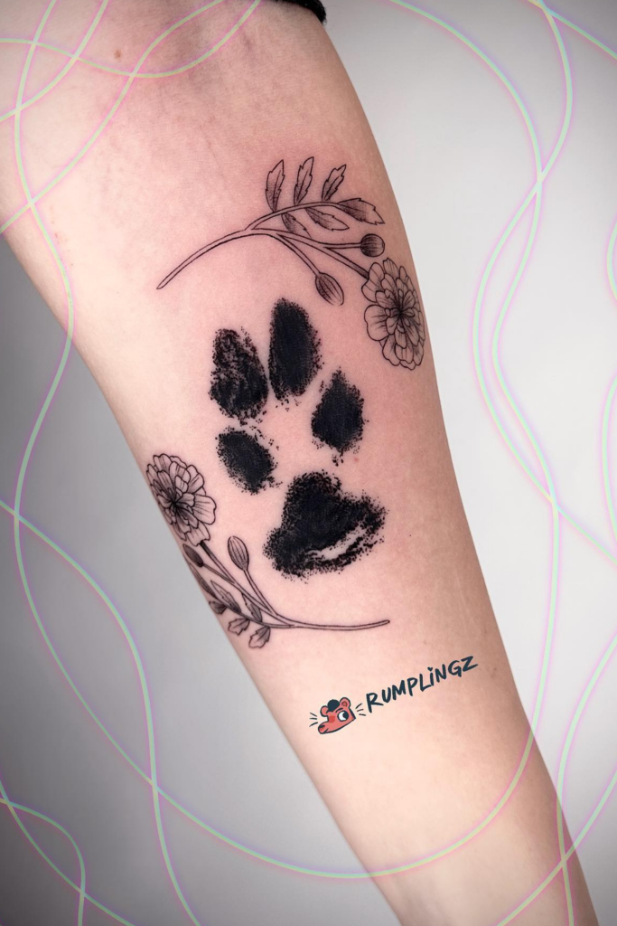 Paw print and flower tattoo
