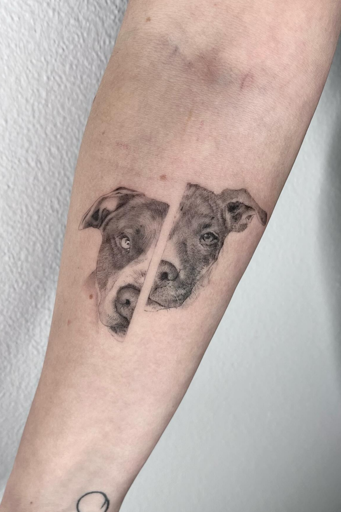 Geometric split face dog portrait tattoo on an arm.