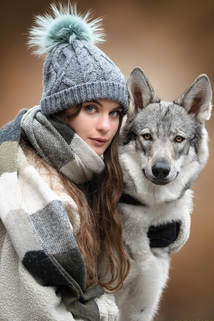 Woman and her dog pose for a portrait shot