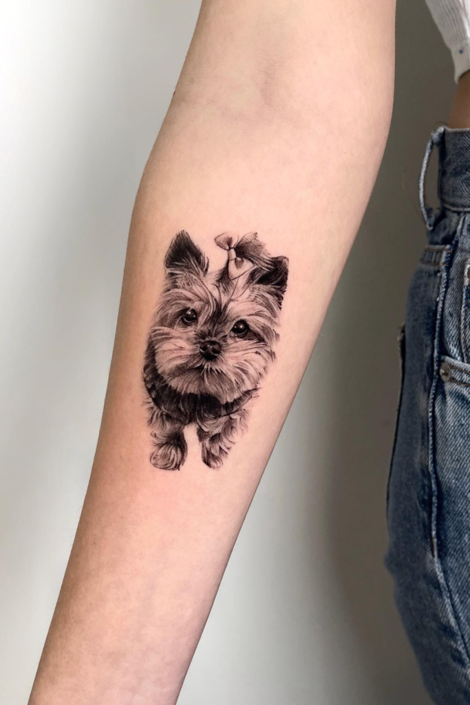 Yorkshire Terrier tattoo on a person's forearm